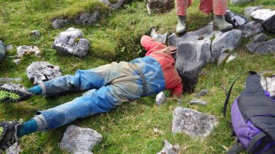 Tom looses his head over a hole near our picnic spot!